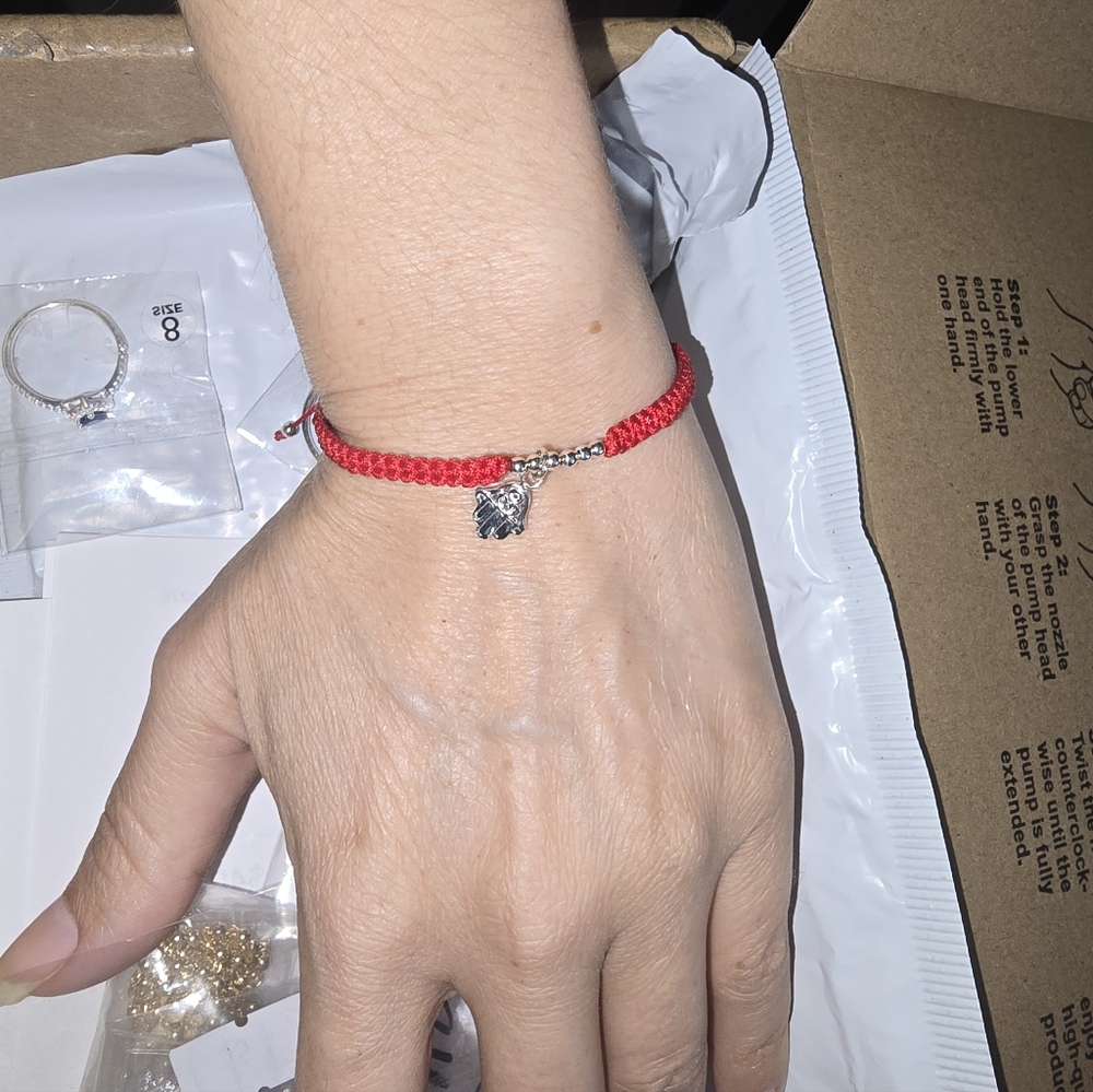 Red Braided Bracelet with Silver Charm